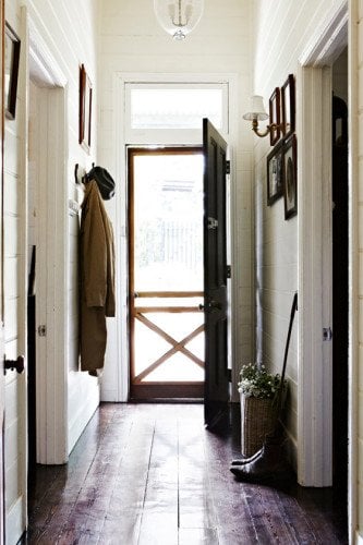 white wall and dark furniture