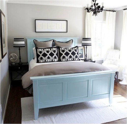 pale blue bed with black and taupe accents