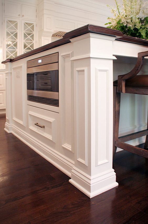 The floor is white oak stained in a walnut hue. The island top (1 1/4â³ thick) is walnut and there is only a clear coat on it to enhance the woodâs naturally deep and rich tones. Hardware: The pulls on island are 6â³ and the perimeter kitchen drawers are 4â³; they are from Atlas Hardwareâs Sutton Collection Style 291 in polished nickel finish; the knobs are also from Atlas Hardwareâs Sutton Collection, Style 292 in polished nickel finish.