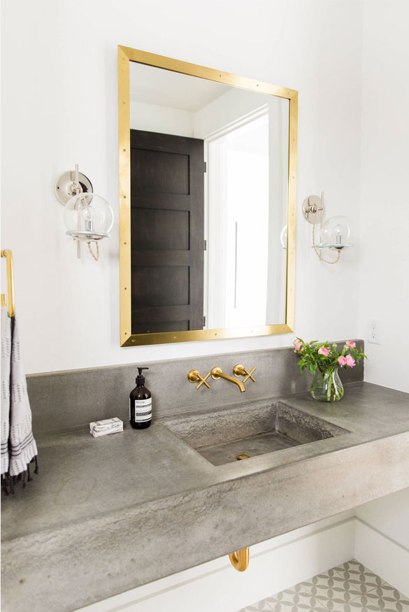 brass and concrete bathroom trend