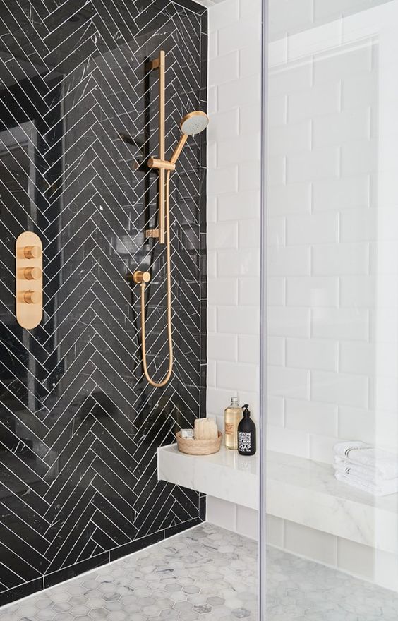Black Marble Herringbone shower with gold fixtures
