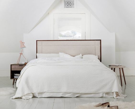 soft warm browns add to the gray and white bedroom
