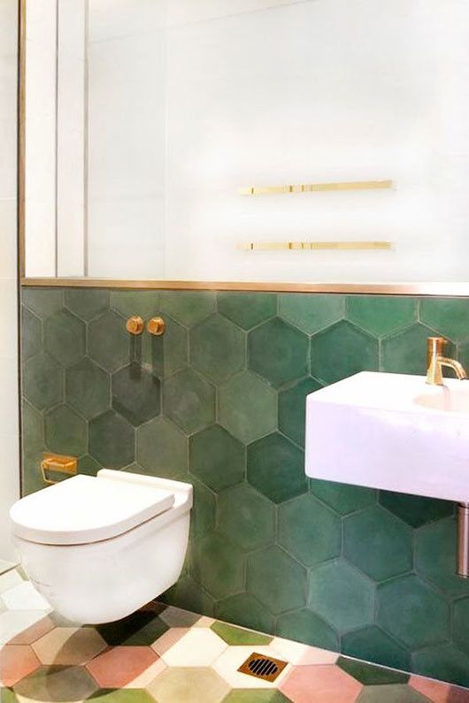 deep green hexagon tiles with gold finishes More