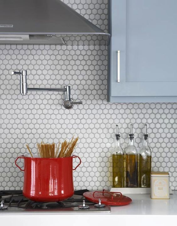 refreshing to see these classic hex tiles put to use as a backsplash as opposed to a bathroom floor.