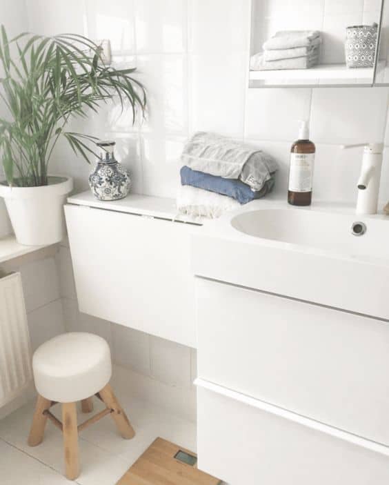 A Fold-Down Shelf Is Useful for Smaller Bathrooms