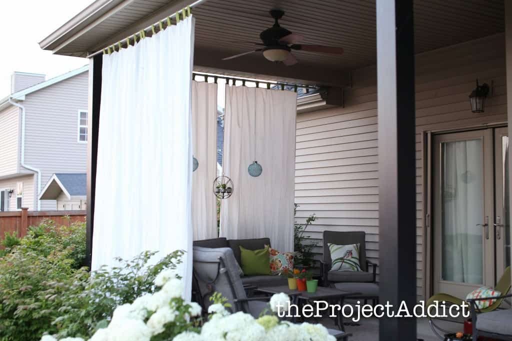 Hang Some Outdoor Curtains Around the Porch