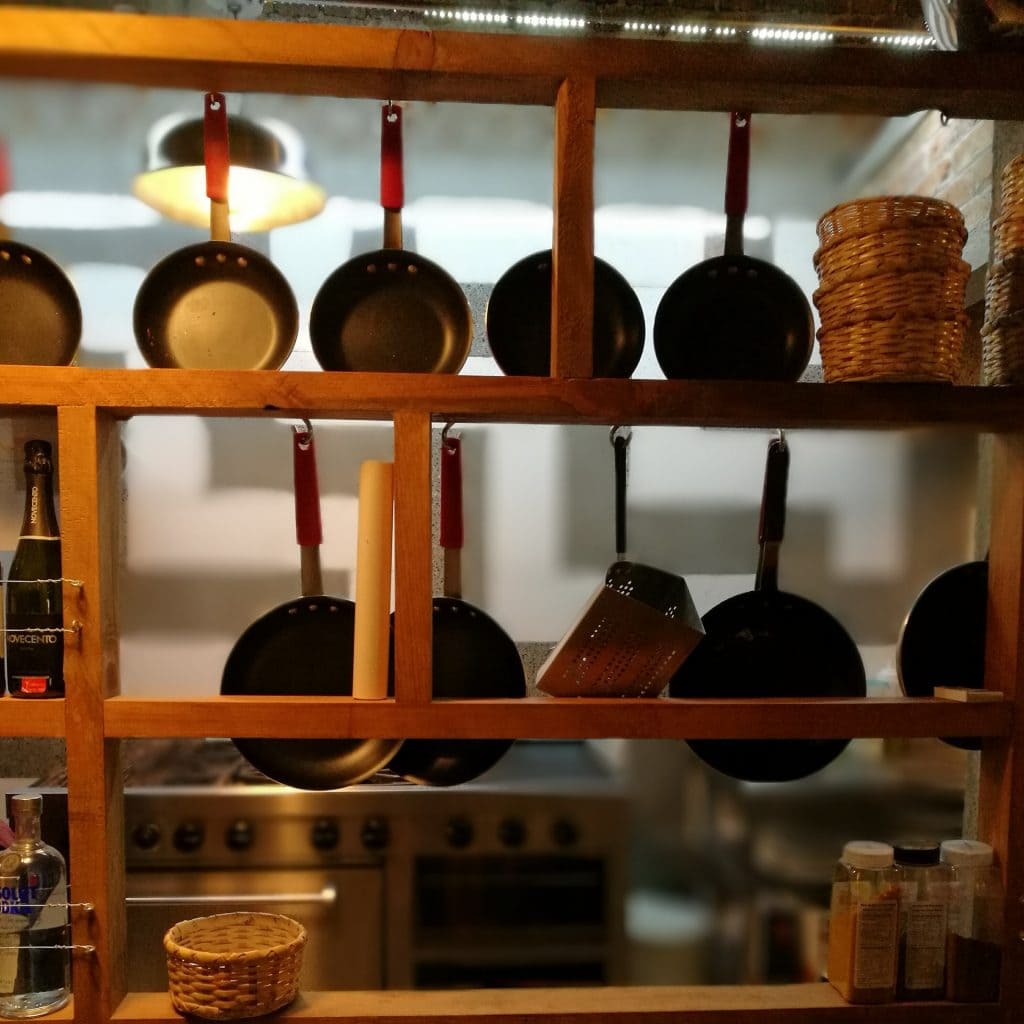 A Wooden Look with Utensil Bar and Pot Rack