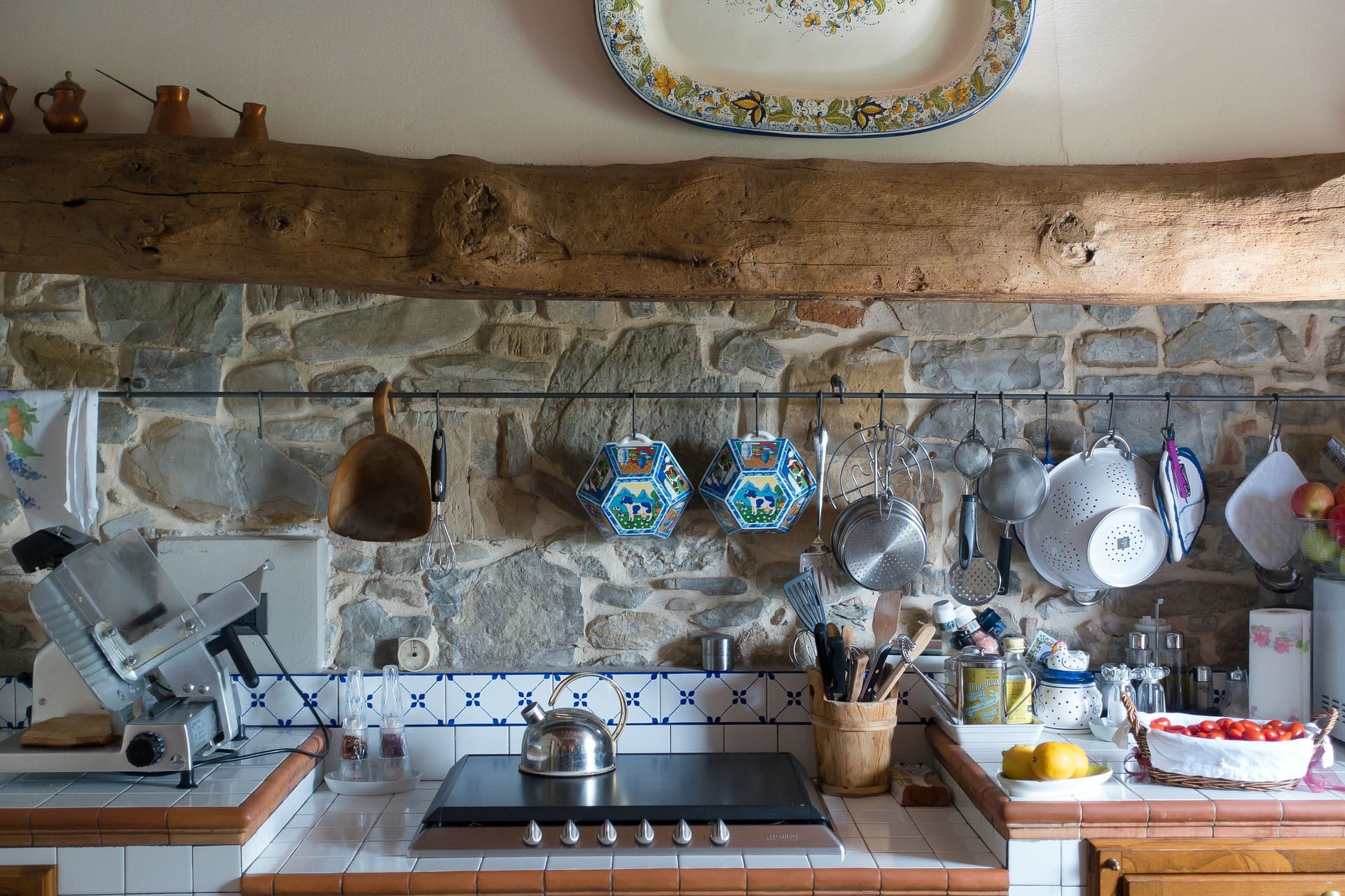 16 Deck Out the Kitchen with a Combination Hand Painted Tiles and Stones