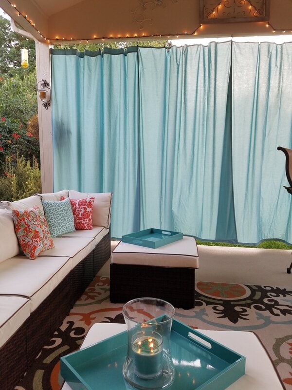 9 Make an Intimate Outdoor Living Room With Some Curtains