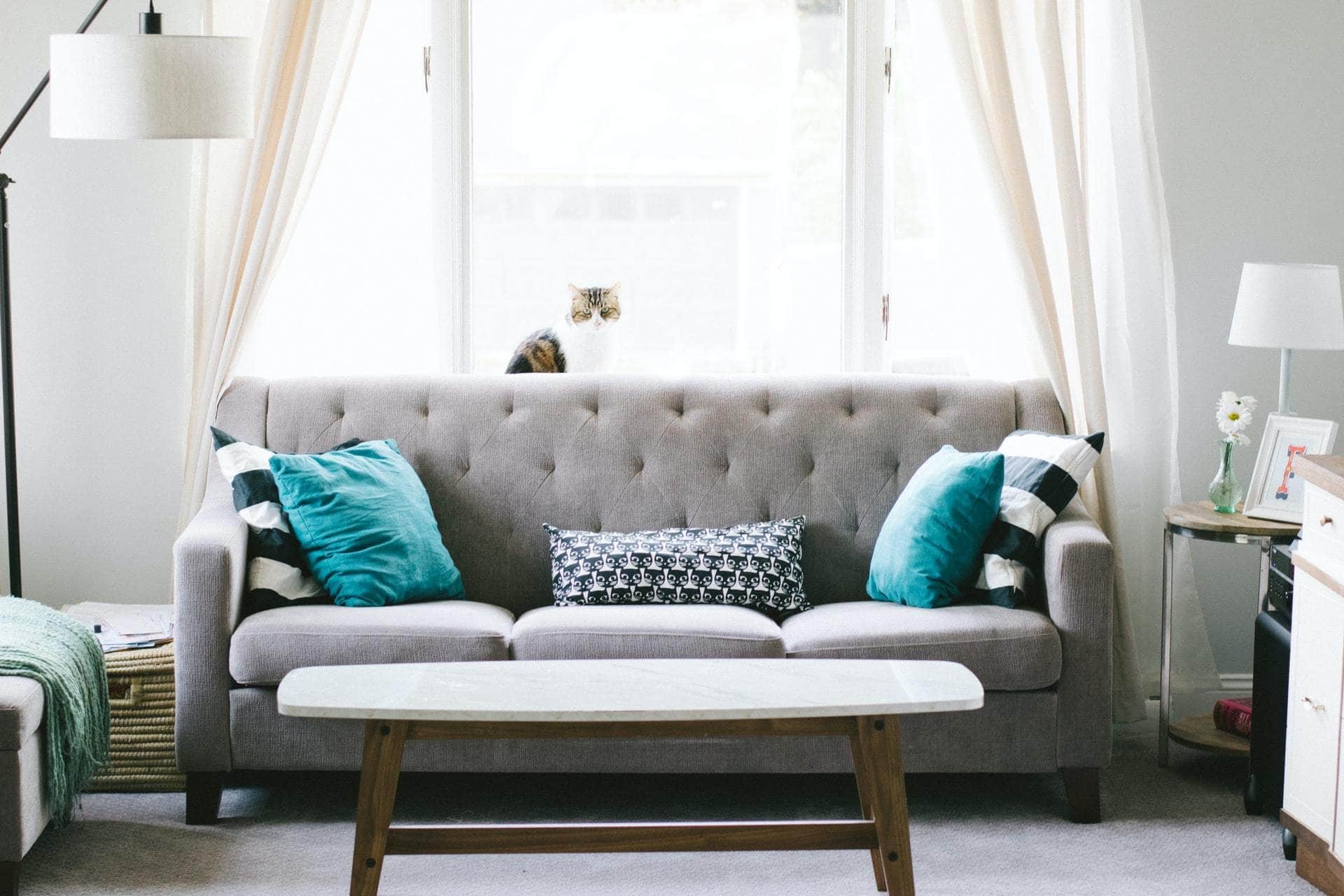 Turquoise Pillows With A Grey Sofa For a Calm Feel