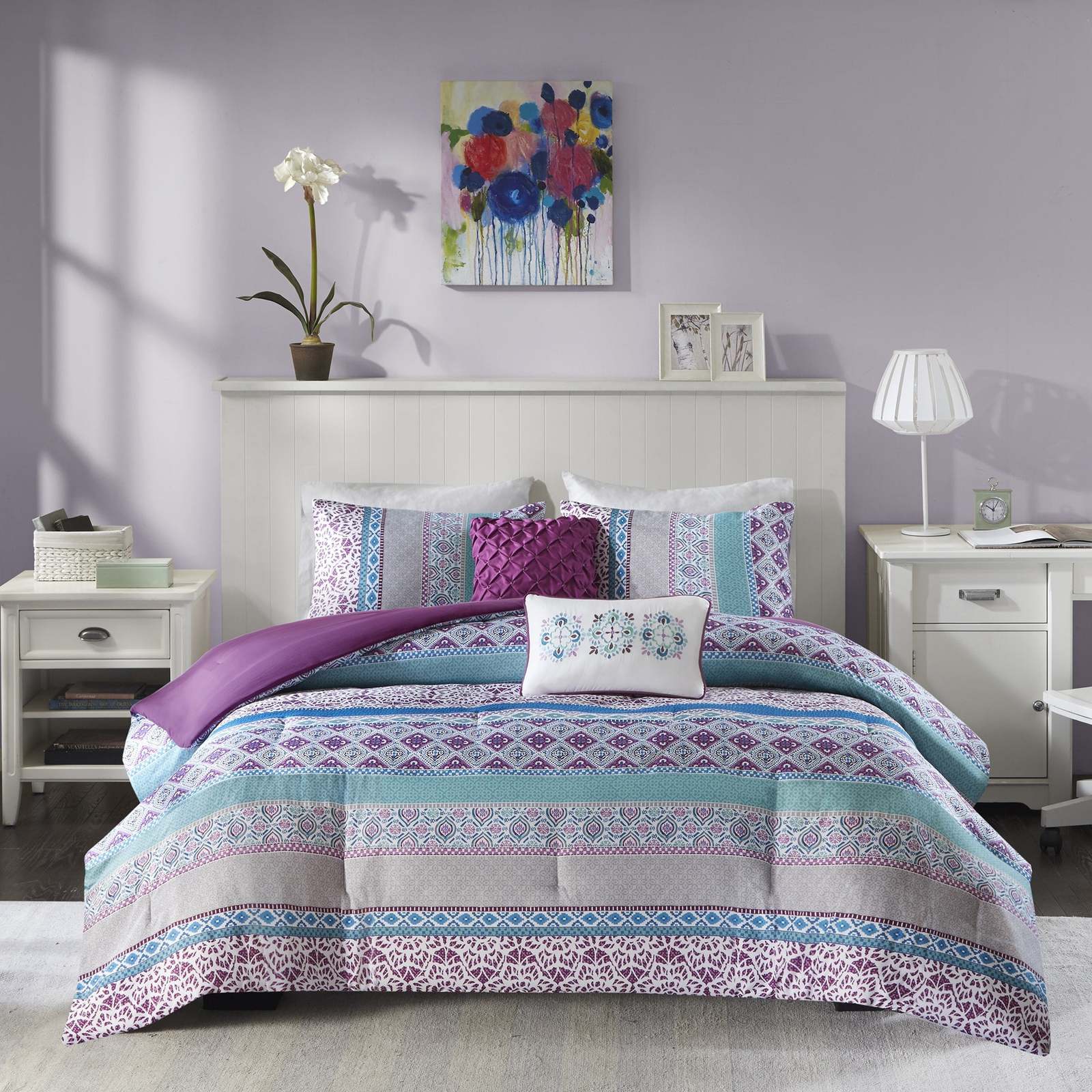 2 Light Purple Walls With A Patterned Comforter 