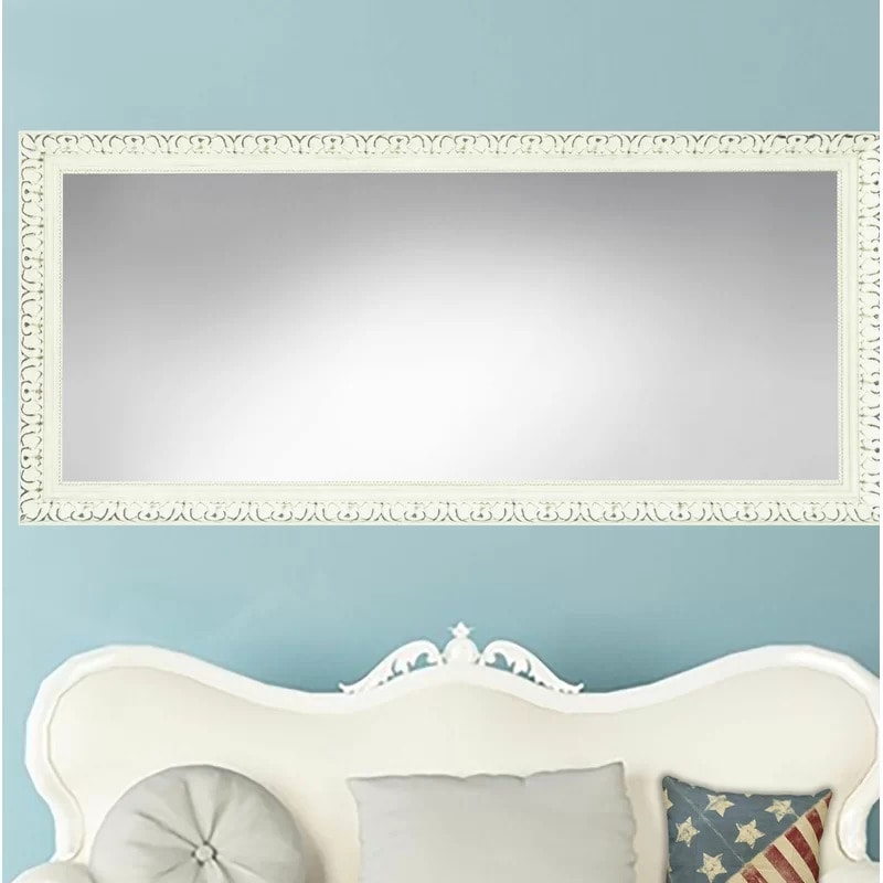 Go For a Classic Look With a Distressed White Framed Mirror