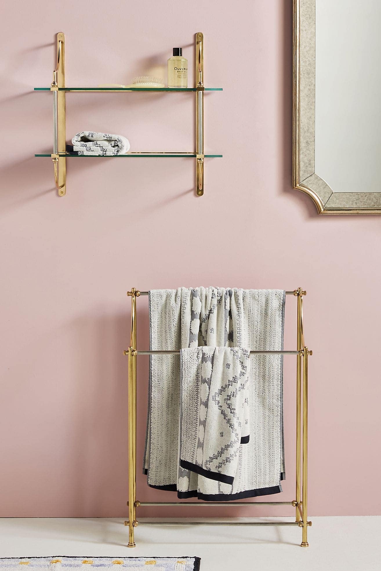 Gold Accents in a Pink and Grey Bathroom