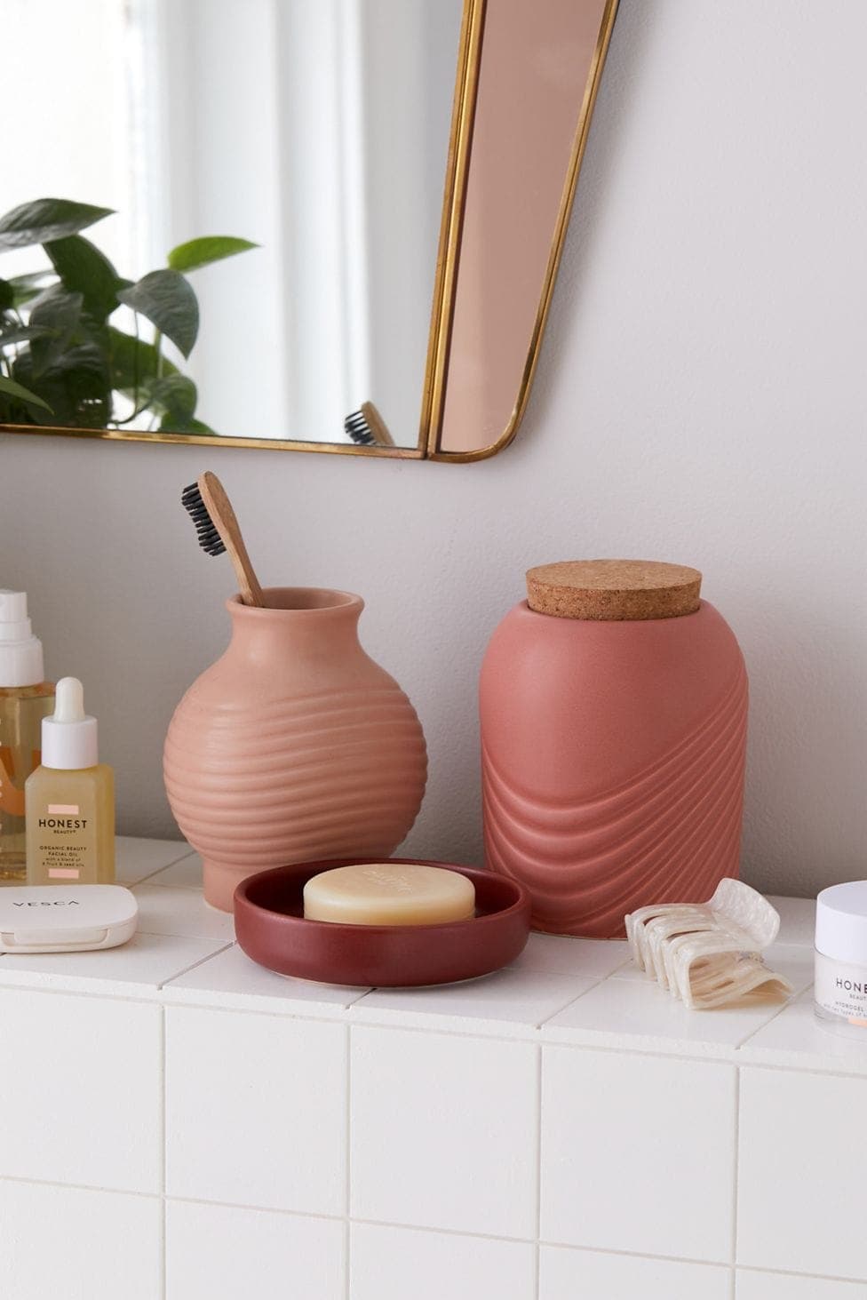 Add Color to a Grey Bathroom With Pink Accessories