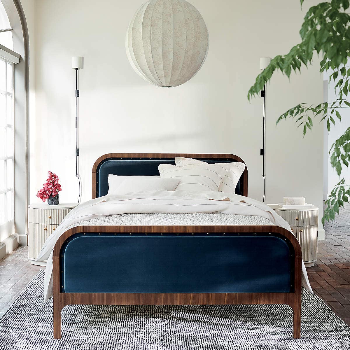 Contrast Beige Walls with a Dark Walnut and Blue Bed