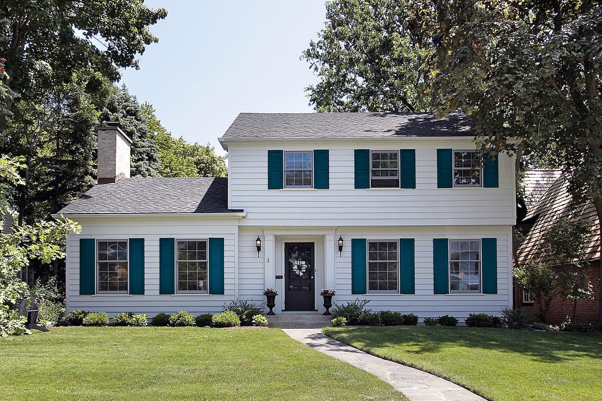 Transform Your Home: Brick House Painted White with Black Shutters ...