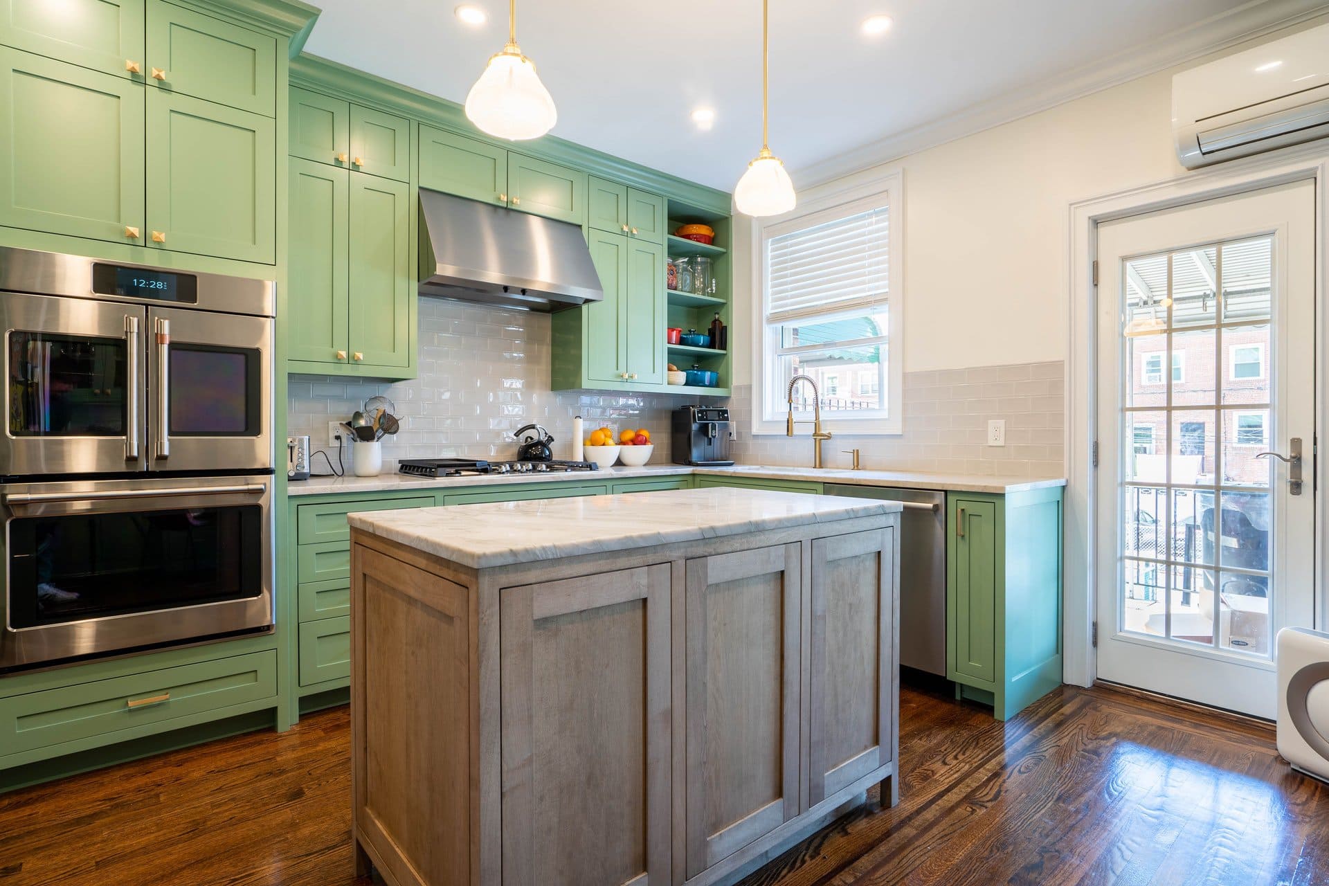 3. Green Cabinets with Red Toned Wood Floors