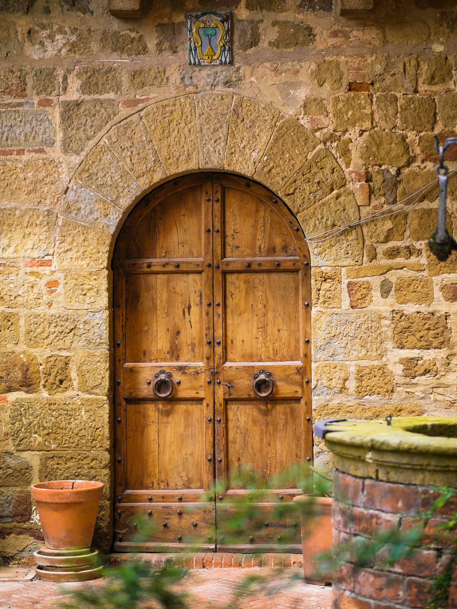 3. Arched Wooden Front Door