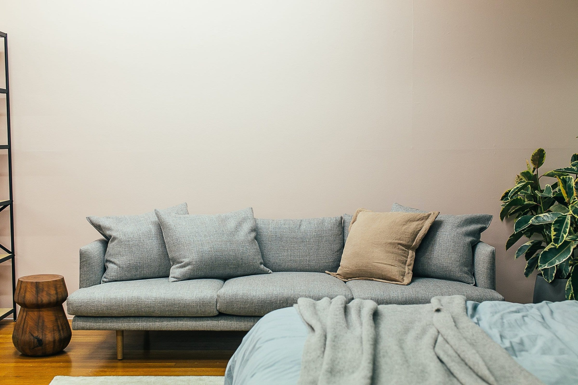  Gray Couch in Front of Beige Wall scaled