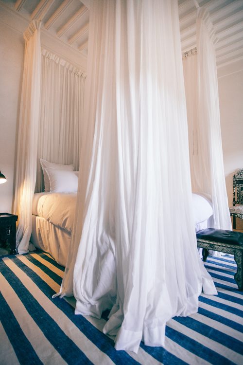 How Do You Hang Curtains Behind A Bed?
