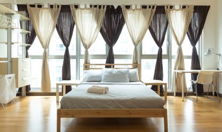 How Do You Hang Curtains Behind A Bed?