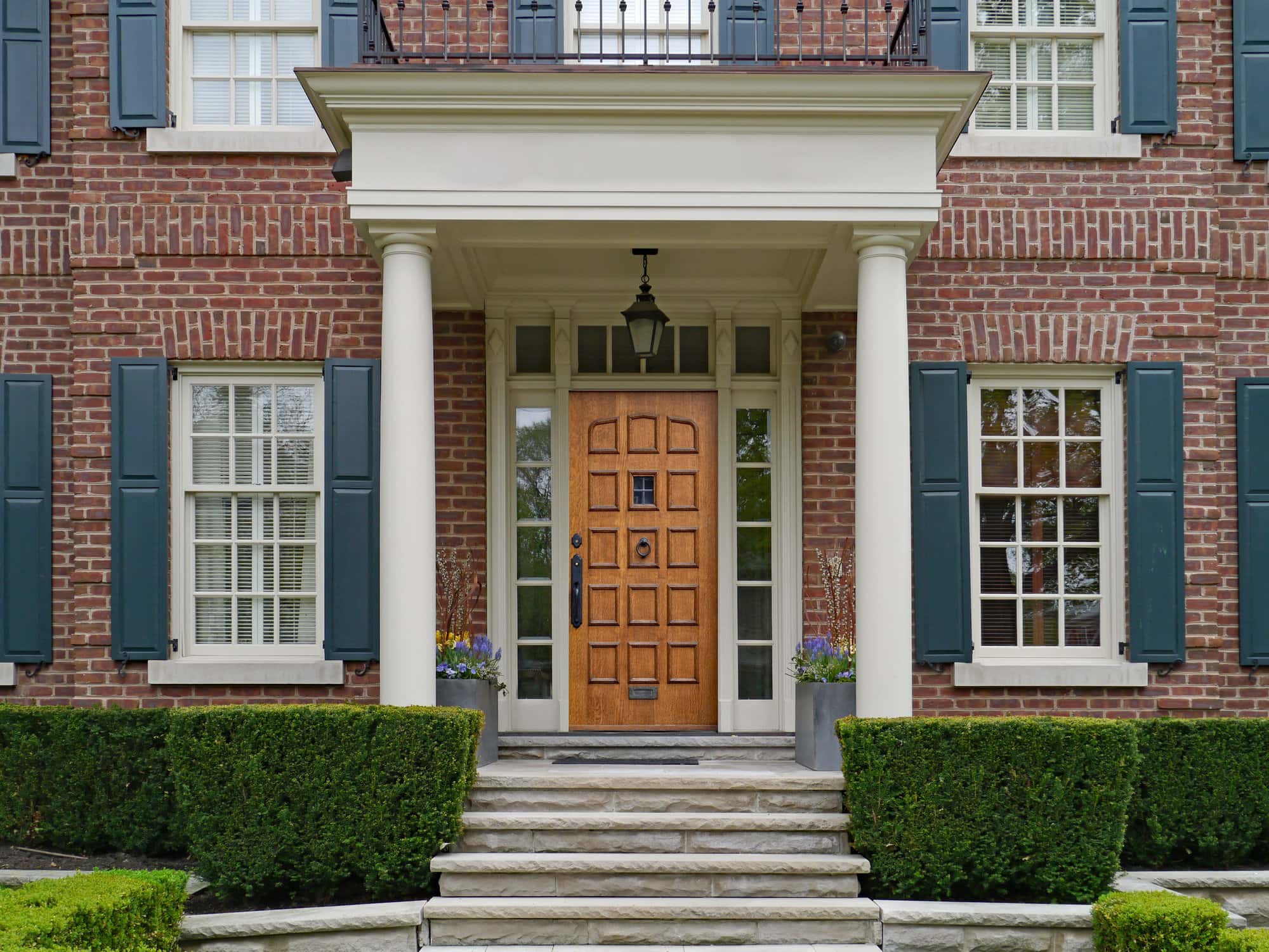  Blue Shutters and a Brown Door Will Look Phenomenal With Your Brick Exterior