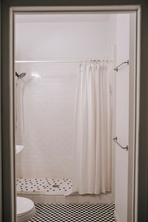 Should Shower Curtains Touch The Floor?